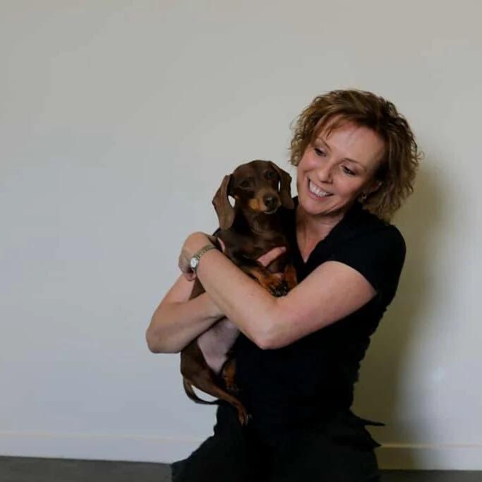 Michelle Monk Inside Her Rehabilitation Clinic With Cute Dachshund